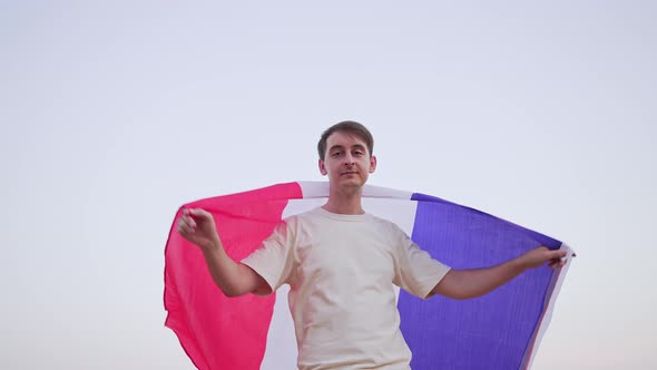 Happy Patriot of France with a Flag in His Hands