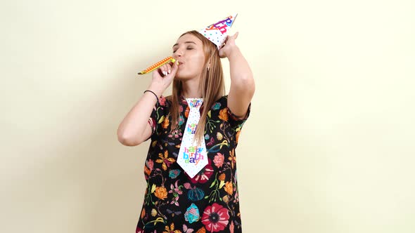 The Cheerful Young Woman Is Having Fun Celebrating Her Birthday. alt