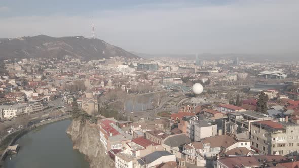 Aerial view of Metekhi church in old Tbilisi located on cliff near river Kura. Georgia 2021 winter alt