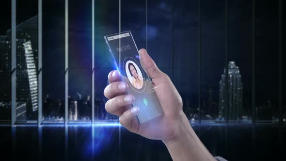 Hand holding futuristic mobile phone against digitally generated background alt