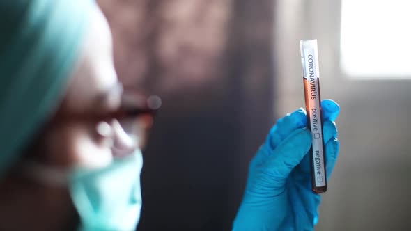 Doctor holding a coronavirus COVID-19 test tube