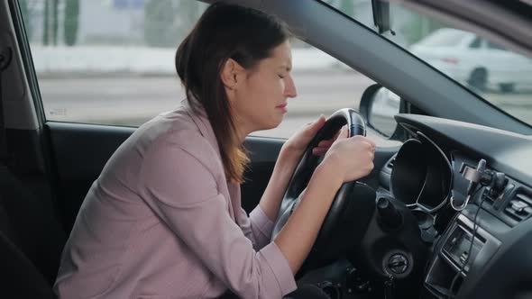 Depressed Crying Woman Inside Car Female Driver is Suffering Inside Automobile alt