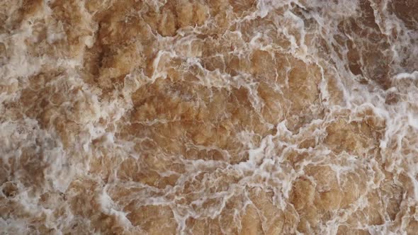 A fast and heavy streaming water in the canal.