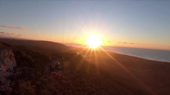 Free Paragliding Flying at Sunset in Ocean Coast Mountains in Morocco Adrenaline Adventure alt