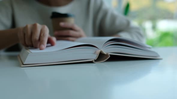 Closeup of a woman reading book