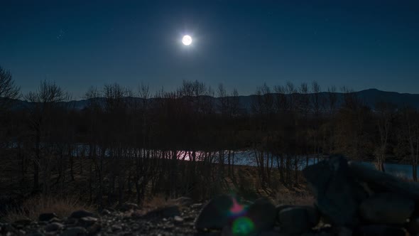 Moon rising by the river 