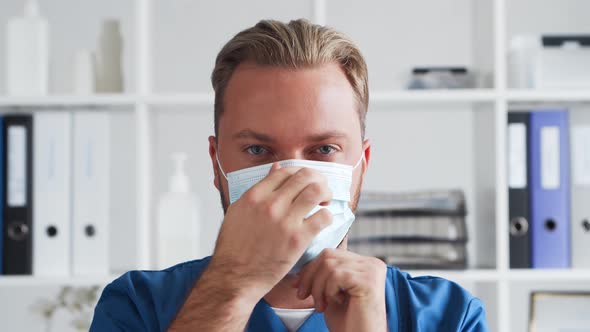 Professional medical doctor in hospital office, Portrait of young and confident physician. alt