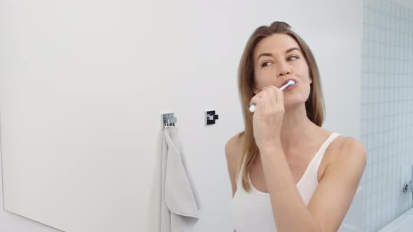 Woman Brushing Teeth