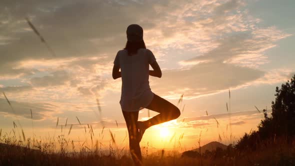 Female Meditating at Sundown alt