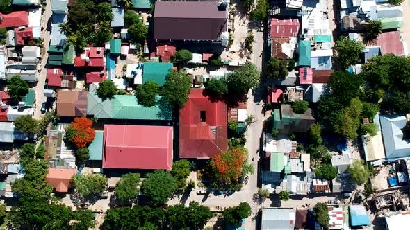 Aerial top down of cars and bikes in El Nido Town, Palawan, Philippines alt