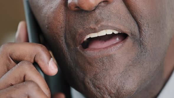 Unknown Half Face Part Old Wrinkled Emotional Businessman African Mature Man Talking on Mobile Phone alt