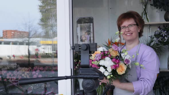 Florist blogger recording floristry video, conference calling