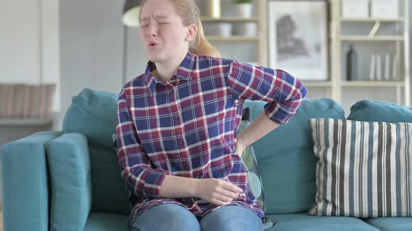 Young Woman Having Back Pain alt