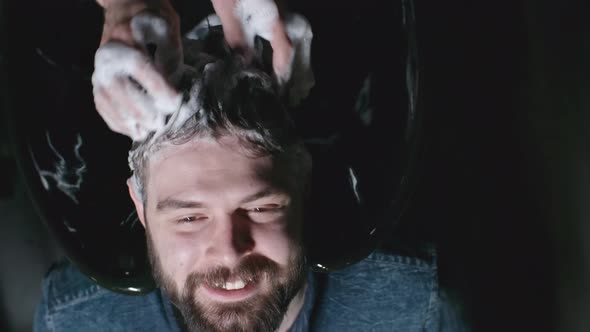 Happy Client Getting Hair Washed at Barbershop alt