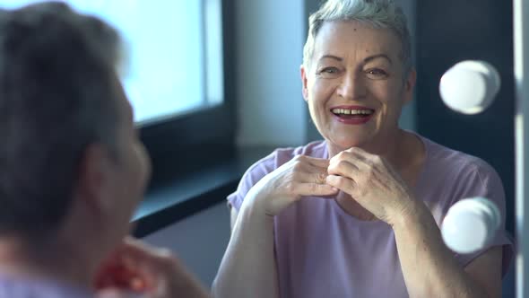 Closeup Photo of a Grayhaired Smiling Elderly Woman Skin Care and Make Up alt
