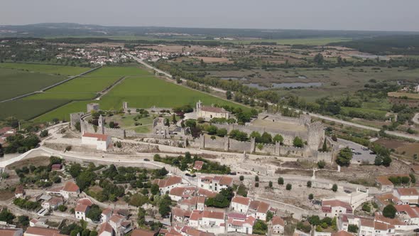 Aerial view of Montemor-o-Velho castle in Portugal town, drone establishing shot