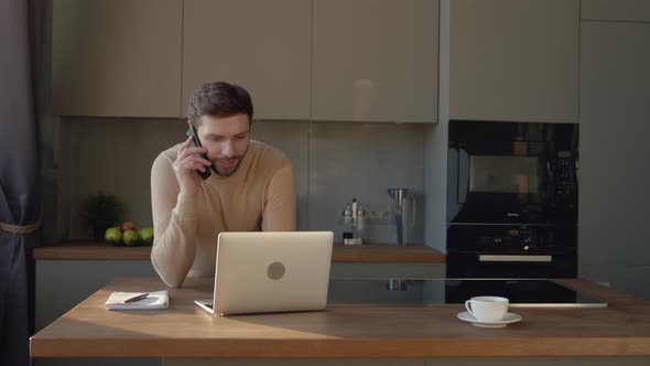 Young man having phone call. Portrait of young man calling phone indoor alt