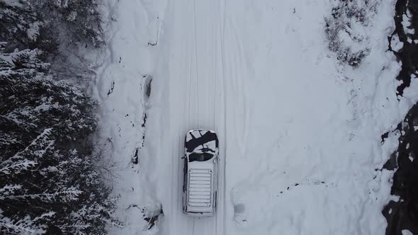 Winter Forest View Over A Car On Snow Covered Road