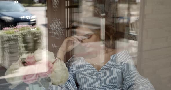 Girl Tenderly Smiling Sitting By The Window alt