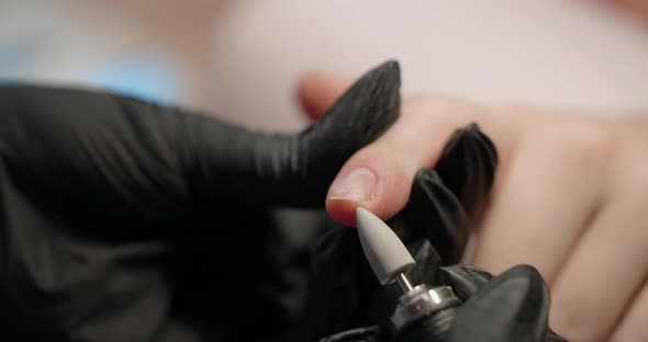 Cropped Manicure Procedure in Slow Motion at the Beauty Salon Nail Filing and Cuticle Trimming