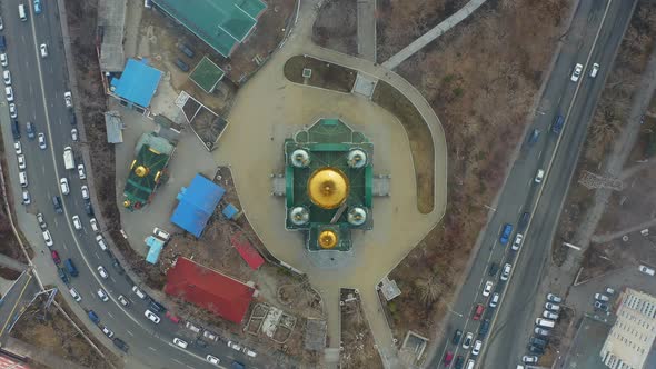 Christian Church Surrounded By Roads with Heavy Traffic at Dawn in Spring alt