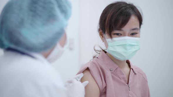 Female doctor vaccinating patient to prevent the spread of the disease.