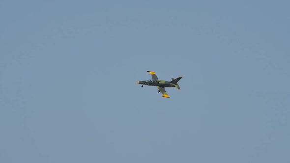 Military Light Combat Jet Aircraft in Flight with Open Landing Gear Slow Motion alt