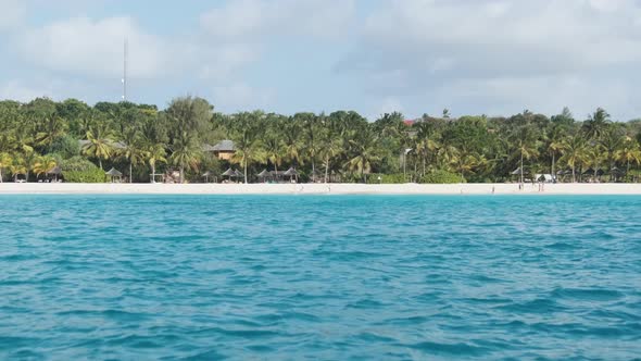 Zanzibar Coastline with Sandy Beach Palms and Hotels alt