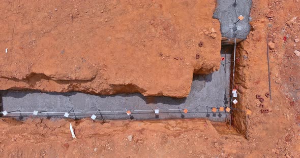 Foundation of a House Under Construction with Building a Strip Reinforcement Frame alt