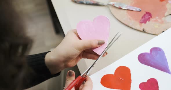 Cutting a Card for St Valentine's Day From Paper