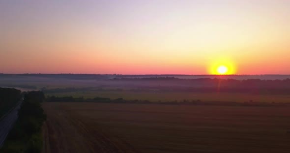 Drone Shot Above Fields and Way Sunrise Morning