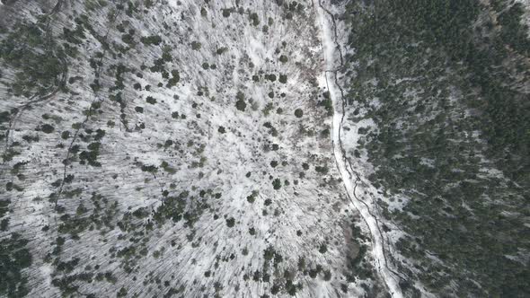 Spring snow mountain drone view alt