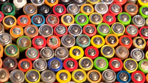Many used batteries. Harmful effects of batteries on the nature of the Earthies. alt