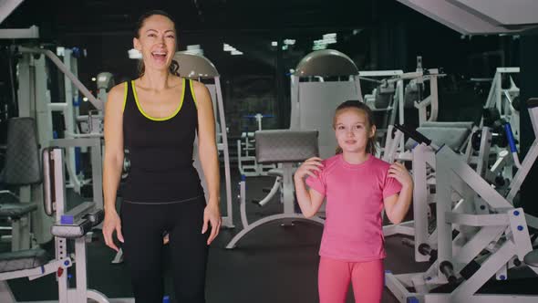 Mother and Daughter in the Gym Family Performs Physical Doing Exercises Fitness Healthy Lifestyle