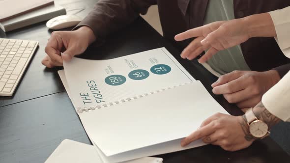 Cropped Colleagues Leafing Through Docs alt