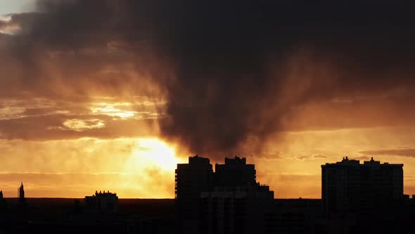sunset sky against the background of urban buildings and residential buildings, roofs alt