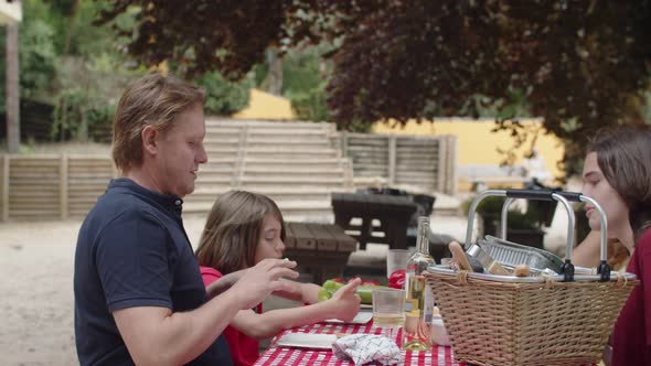 Slider Shot of Friendly Family Having Dinner Outdoor alt