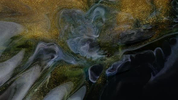 Beautiful Gold Shimmering Particles with Lens Flare on Black Background in Slow Motion alt