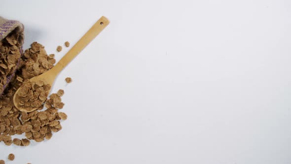 Granola spilled on spoon 4k alt