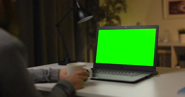 Laptop with Green Screen at Home