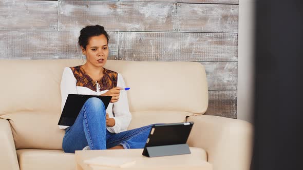 Freelancer Woman Having a Video Call on Tablet Computer alt