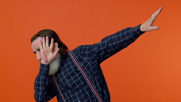 Trendy Positive Elderly Man Having Fun Dancing Dabbing Raising Hands Making Dubdance Gesture alt