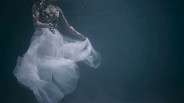 Young woman under the water