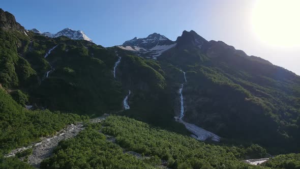 Taimazi Waterfalls Flowing Down From the Slope of Taimazi Mountain alt