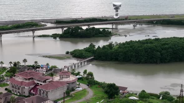 Anaklia, Georgia - July 16 2022: Aerial view of Anaklia-Ganmuhkuri Pedestrian Bridge at sunset alt