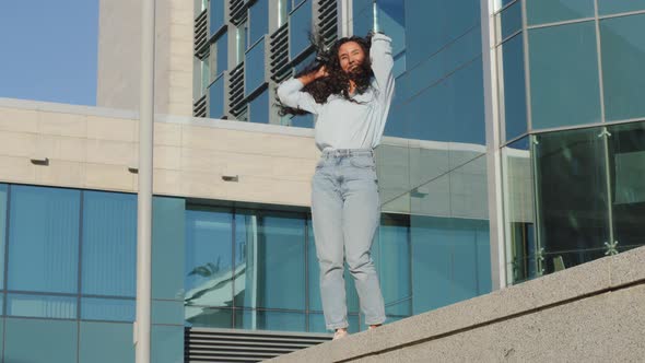 Happy Joyful Carefree Girl Active Moving Dancing Woman with Long Hair Lady Student Winner Dance alt