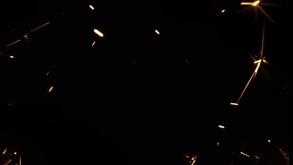 Sparkling Splashes of Bengal Fires on Black Background alt