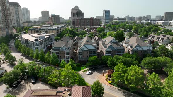 Summer day in Texas. Aerial truck shot of residential suburban city district. Houses and apartment b alt
