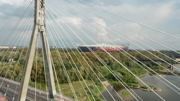 Aerial drone view of Świętokrzyski Bridge and The PGE Narodowy National Stadium in the background. W alt