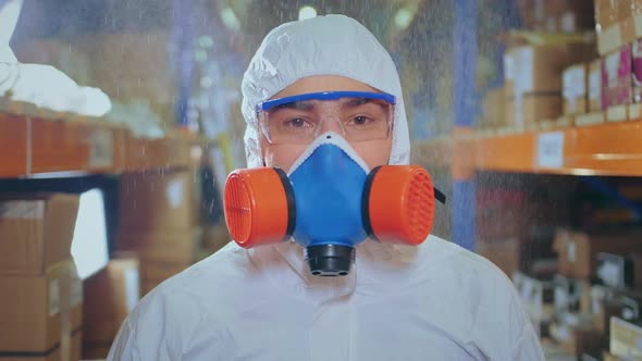 Disinfecter Virologist in Resperator Looking at Camera. Coronavirus. Covid-19. alt